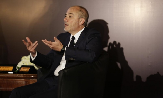 Speaking at a news conference in Cairo, Stephane Richard says his company intends to withdraw the Orange brand from Israel as soon as possible. Photograph: Thomas Hartwell/AP 