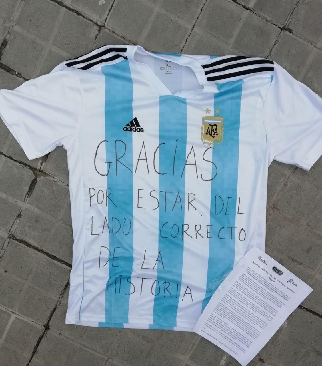 (Photo: "Thank you for being on the right side of history" written on Argentina's national football team jersey)